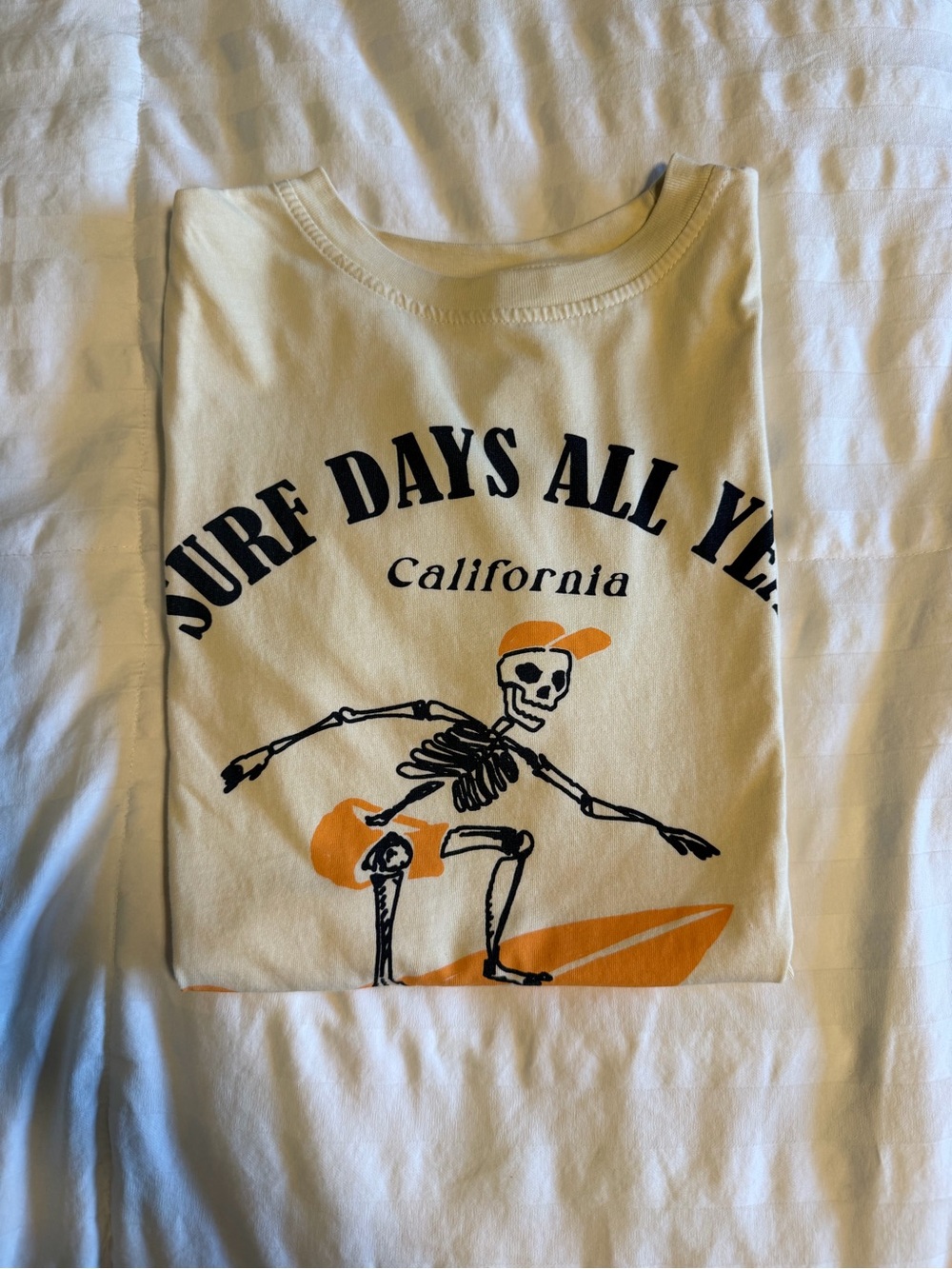 Zara Cream Tee with Orange & Black Surf Skeleton Graphic